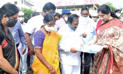 Minister for Tribal Welfare Satyavathi Rathod discussing flood situation with GWMC Mayor G Prakash Rao