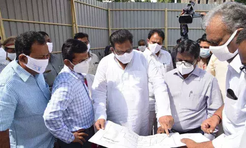 District In-charge Minister Ch Sri Ranganatha Raju examining GGH development plans in Guntur on Thursday. District Collector I Samuel Anand Kumar, MP Mopidevi Ramana Rao, Joint Collector AS Dinesh Kumar, MLA Mustafa also seen