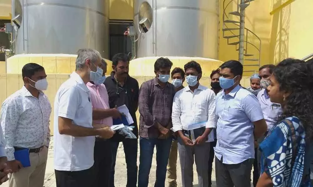 Chittoor Collector  Dr Bharath Narayan Gupta and Joint Collector (development) Veerabramham briefing the Amul team over dairy industry in Madanapalli on Friday