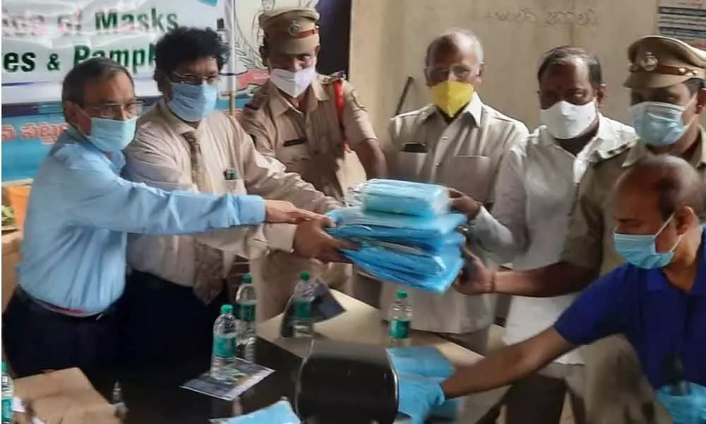 PPE kits, sanitisers and masks given away to the police personnel by Hima Humanitarian Association in Visakhapatnam on Friday