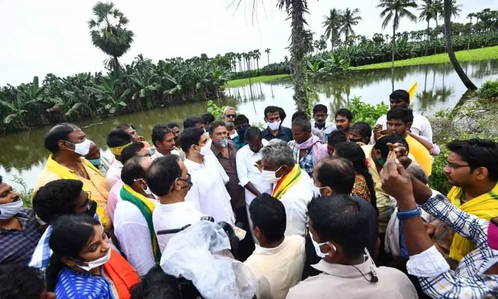 TDP national general secretary Nara Lokesh interacting with farmers in Vemuru Assembly constituency in Guntur district on Friday
