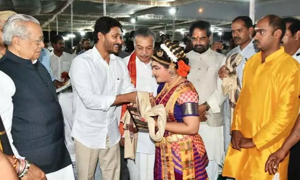 Koka Vijayalakshmi receiving appreciation from Chief Minister Y S Jagan Mohan Reddy at State Formation Day celebrations