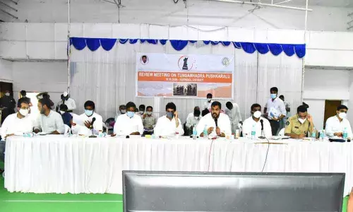 Irrigation and District In-charge Minister Anil Kumar Yadav addressing at Sunaina Auditorium in Kurnool on Friday. Finance Minister Buggana Rajendranath Reddy and Collector G Veera Pandiyan are also seen