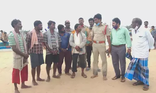 The seven fishermen from Kakinada explaining their plight to the police and fisheries officials at Vadarevu on Friday