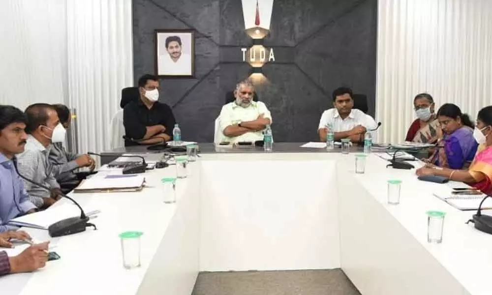 TUDA Chairman Chevireddy Bhaskar Reddy, Collector Dr N Bharat Gupta and other officials at a review meeting held at TUDA office in Tirupati on Saturday
