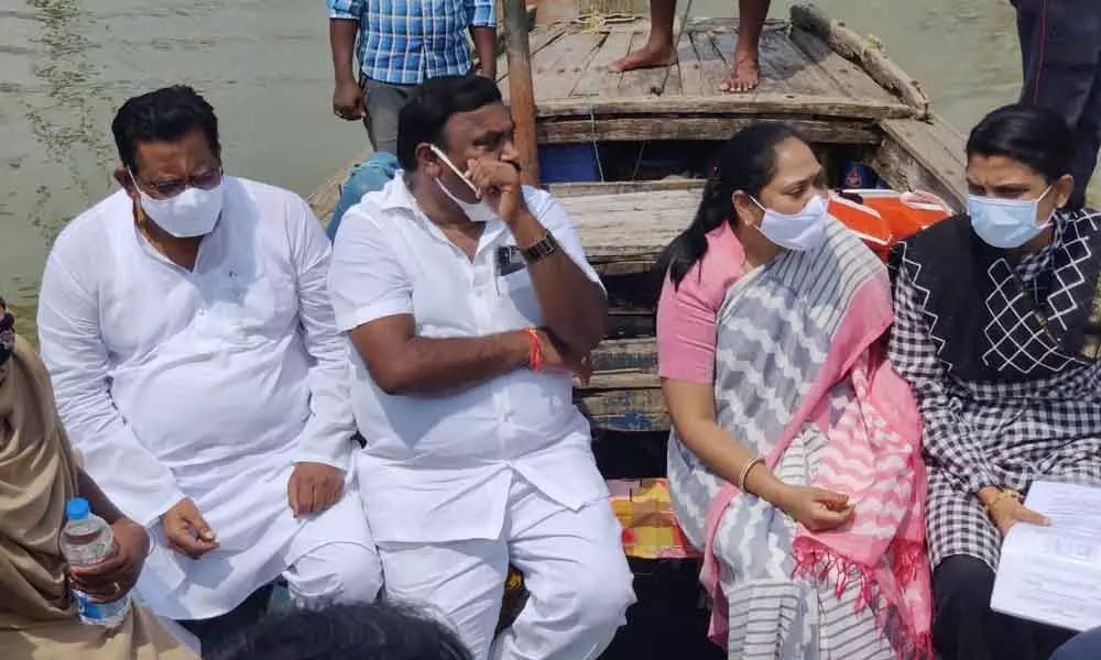 District in-charge Minister Cherakuvada Sri Ranganatha Raju and Home Minister Mekathoti Sucharitha on the way to flood-affected villages in Guntur