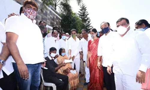 KTR hands over Rs 5 lakh ex-gratia cheques to kin of flood victims