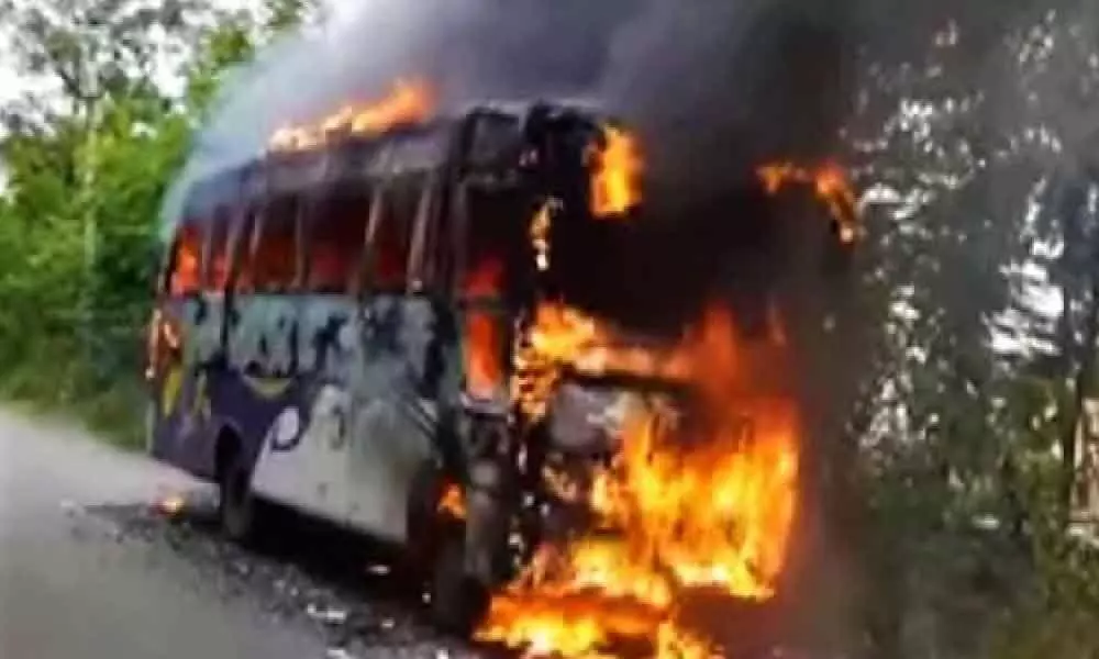 Fire breaks out in a private bus after tire bursts in Vijayawada, no casualties reported