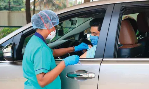 CIS drive-through flu vaccine shots ease Covid fear among parents