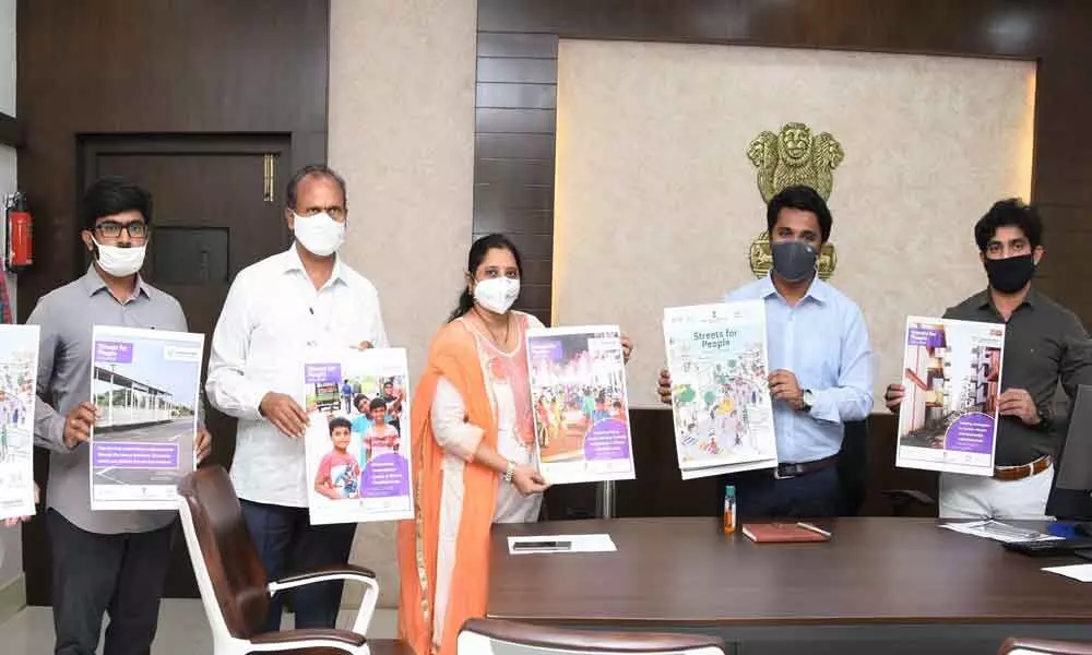VMC Commissioner Prasanna Venkatesh and other officials releasing posters on ‘Streets for People Challenge’ in Vijayawada on Monday