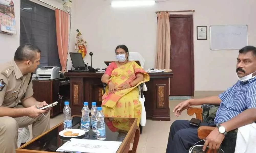 District Judge P Jyothirmai explaining the importance of Lok Adalat to Collector  Dr Pola Bhaskara and SP Siddharth Kaushal in Ongole on Monday