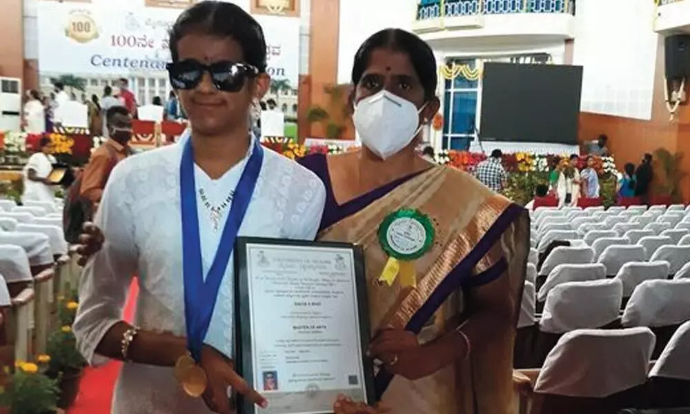 Girl overcomes visual impairment to win 2 gold medals in MA