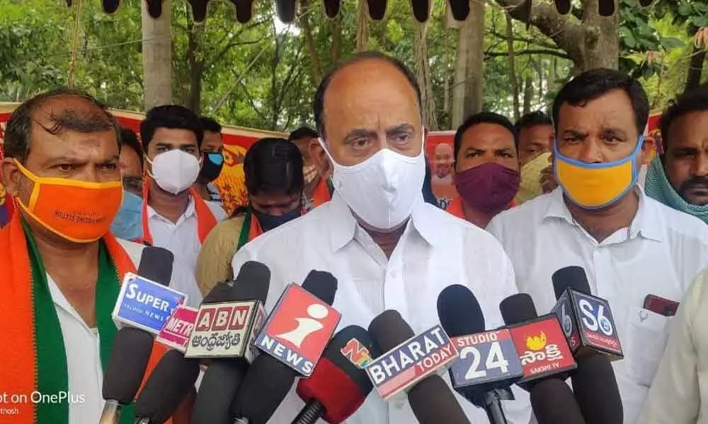 BJP leader Revuri Prakash Reddy speaking with the media at a voter enrolment programme in Narsampet on Tuesday