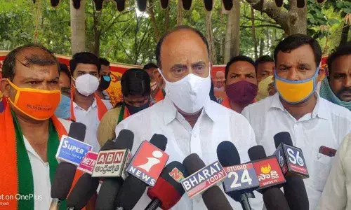 BJP leader Revuri Prakash Reddy speaking with the media at a voter enrolment programme in Narsampet on Tuesday