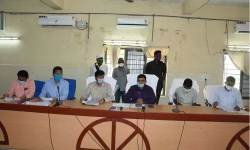 District Collector Dr Sharath speaking at a review meeting on dairy production at Janhita Bhavan of Kamareddy Collectorate on Tuesday