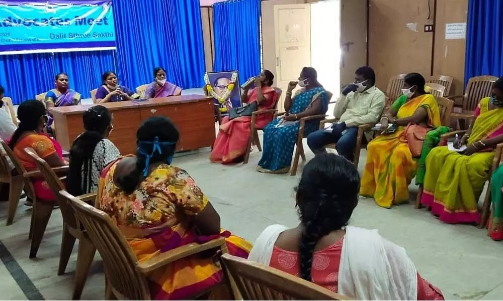 Geddam Jhansi, national convener of Dalit Sthree Sakthi flanked by coordinators Hemalata and Bhagyalakshmi addressing the advocates meeting