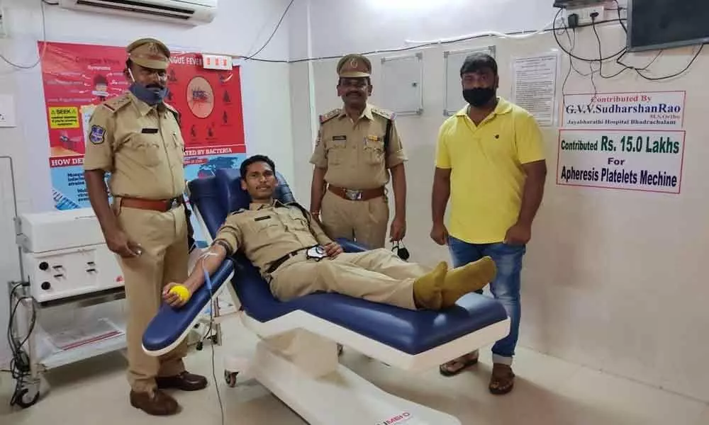 A CRPF police donating blood at a  blood donation camp in Bhadrachalam  on Thursday
