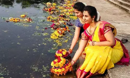 Women playing Bathukamma near Padmakshi Gundam in Hanamkonda, in Telangana on Saturday. Photo: G Shyam Kumar