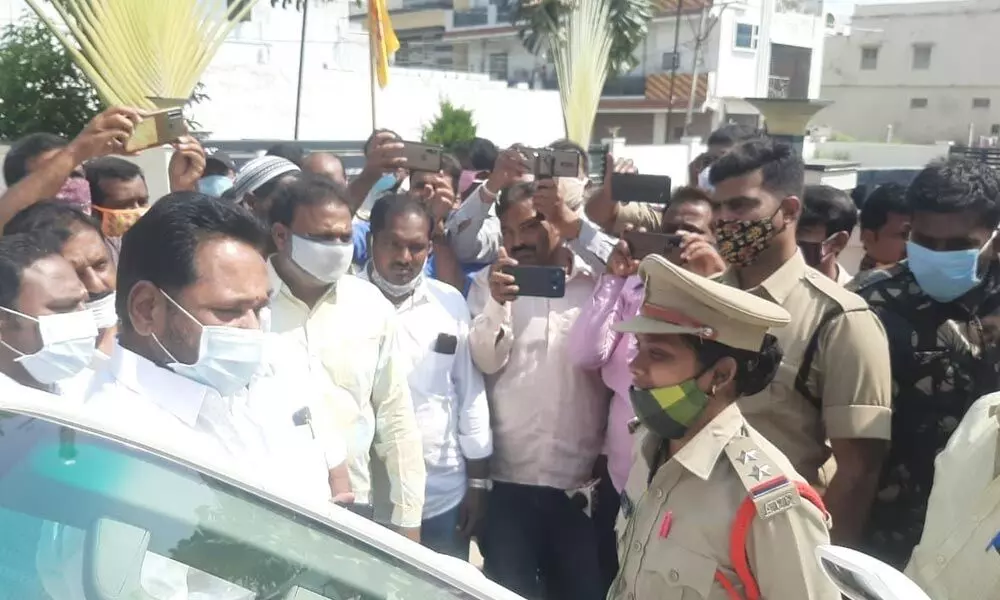 Police detaining former minister N Amaranatha Reddy at his residence in Palamaner on Monday