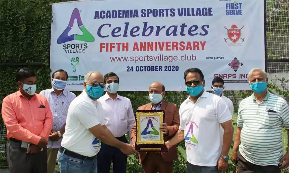 Iftekhar Shareef, the CMD of IGS Group of Companies, and philanthropist and former Director of Shantha Biotech, Khalil Ahmed, pose after they were felicitated by Academia Sports Village (ASV) at HPRC tennis courts on the occasion of the fifth anniversary of ASV in Aziz Nagar. Mohammad Shamsuddin, CEO of Academia Sports Village, Reaz Ahmed from HPRC, and veteran journalist MA Majid are also seen.
