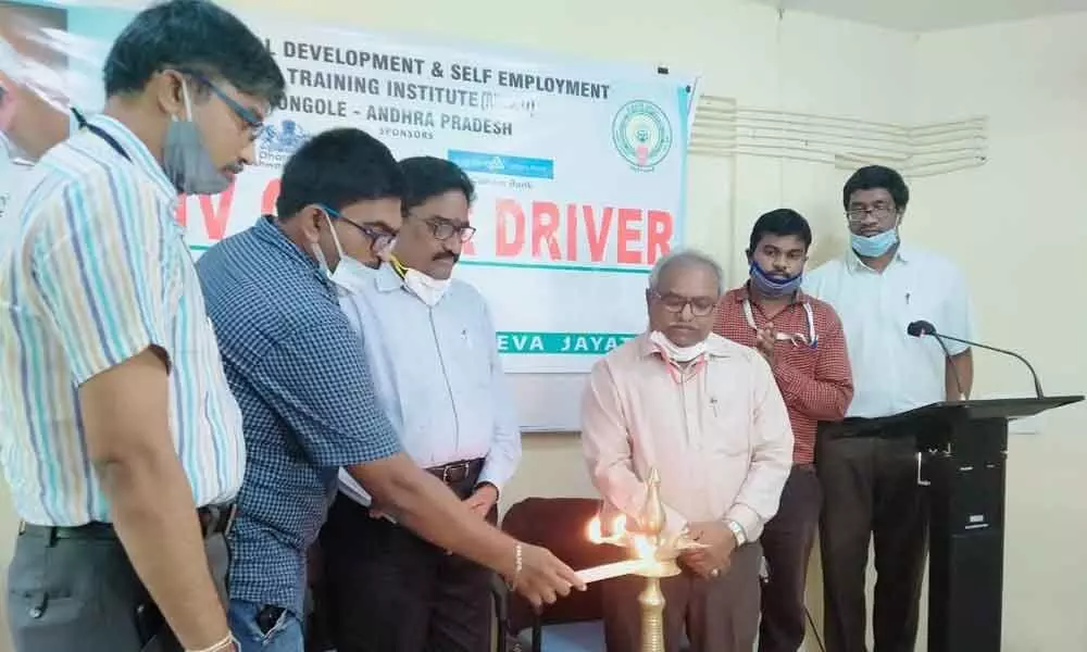 Chief Manager of Canara Bank Raja Aravind, RTO Chandrasekhar Reddy and RUDSETI director GS Murthy inaugurating LMV driving training in Ongole on Tuesday