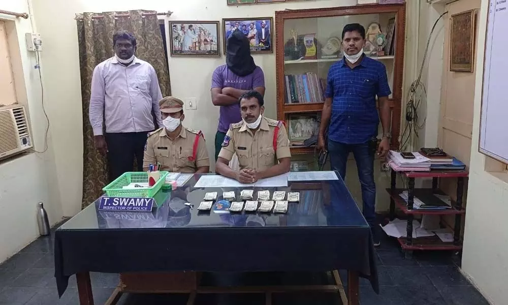 CI T Swamy producing ATM thief at Bhadrachalam police station on Tuesday
