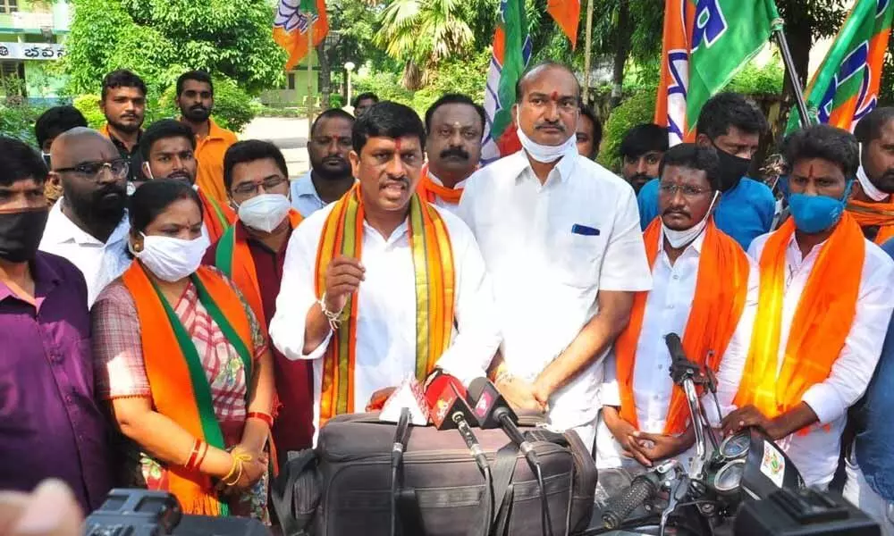 BJP leaders speaking during a protest in Khammam on Tuesday