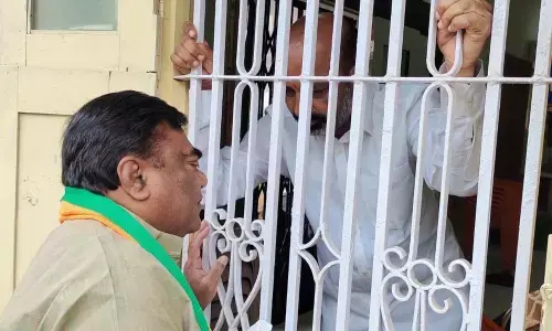 BJP leader Babu Mohan interacting with MP Bandi Sanjay Kumar at his office in Karimnagar on Tuesday