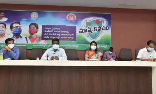 Collector I Samuel Anand Kumar addressing a meeting in Guntur