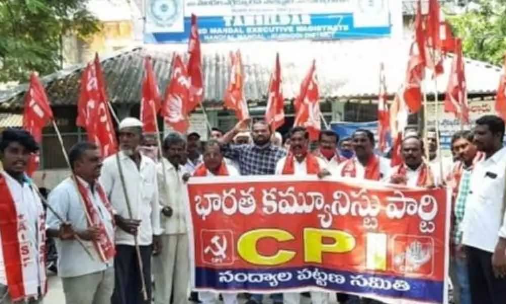 CPI leaders staging a protest in front of Tahsildar’s office demanding the government to distribute house site pattas to all eligible poor,