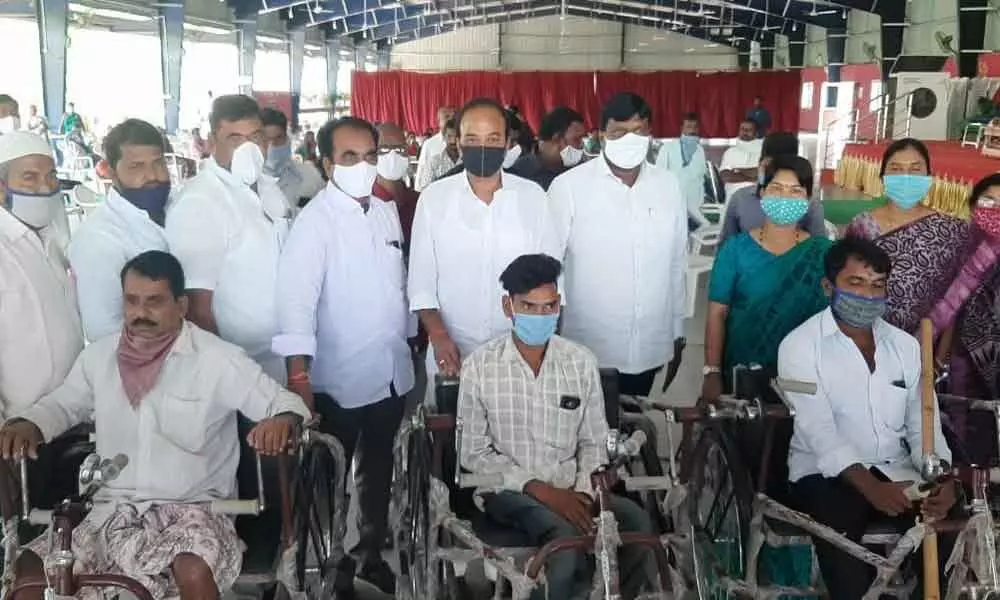 MP Ranjith Reddy, MLA Mahesh Reddy distribute tricycles to disabled