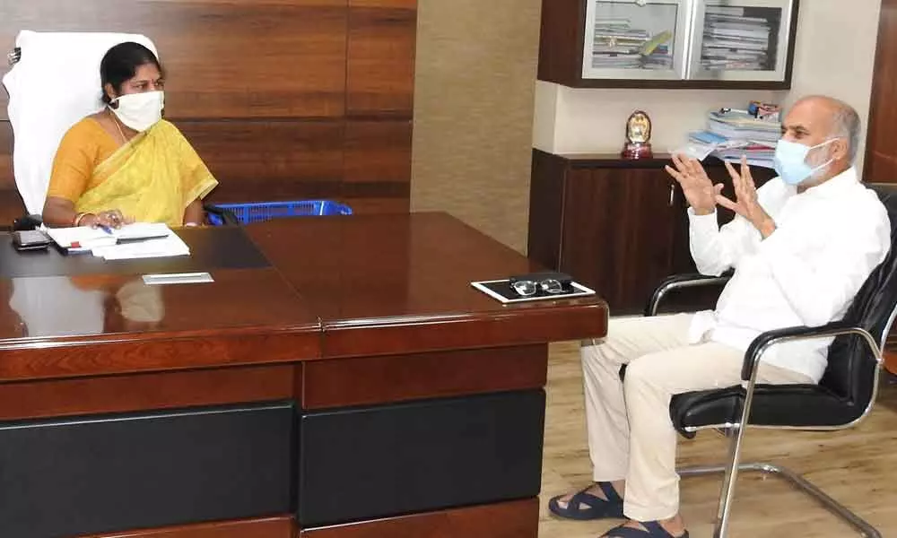 Rajya Sabha Member Alla Ayodhya Rami Reddy discussing with GMC Commissioner Challa Anuradha on city development