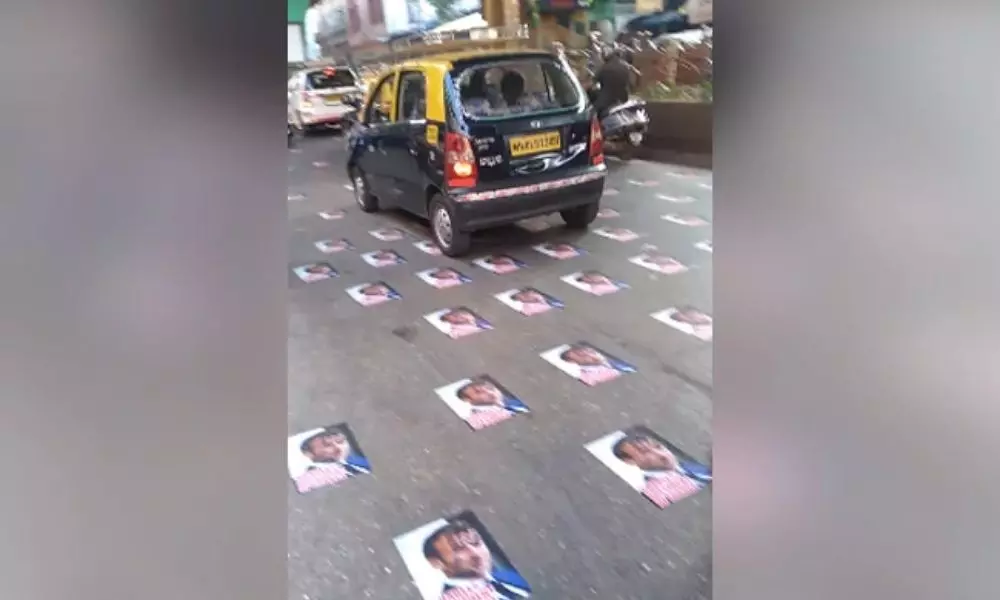 Police remove posters of Macron pasted on Mumbai road