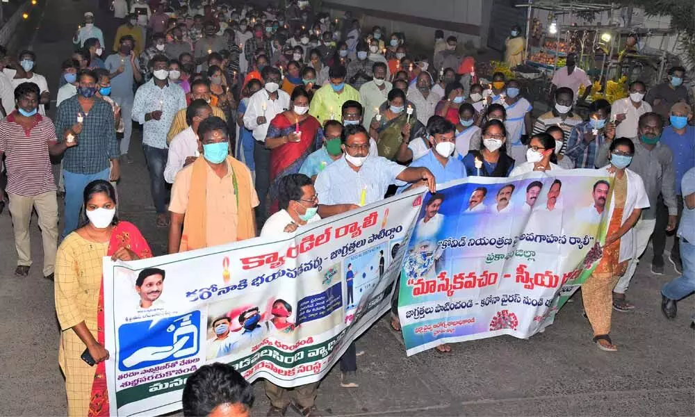 Staff of Ongole Municipal Corporation and the Medical and Health Department taking out a coronavirus awareness rally in Ongole on Friday