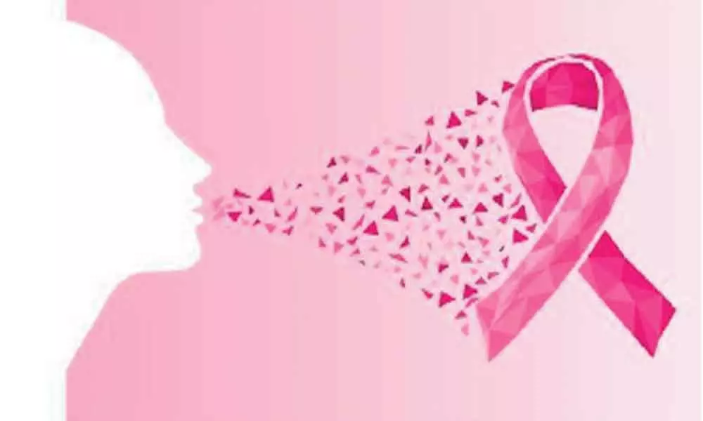 Breast cancer awareness:  Hospital staff wear pink masks