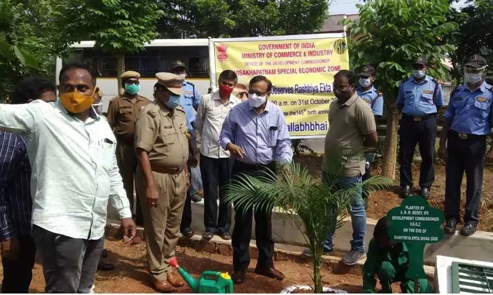 Development Commissioner A Rama Mohan Reddy planting a sapling at the VSEZ at Duvvada on Saturday as part of the celebrations of Rashtriya Ekta Diwas