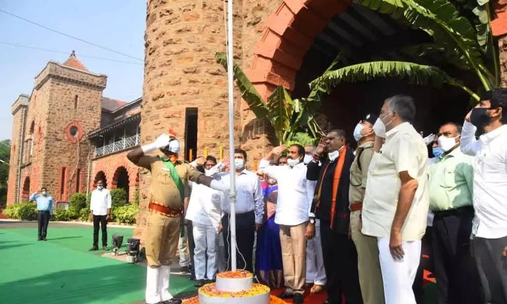 Agriculture Minister K Kannababu and Tourism Minister Muttamsetti Srinivasa Rao saluting the national flag on the occasion of the State Formation Day celebrations