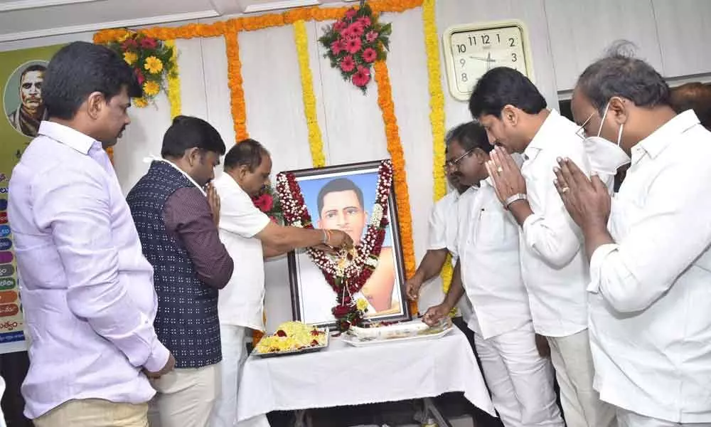 Minister for Roads and Buildings M Sankara Narayana paying rich floral tributes to the portrait of Potti Sriramulu