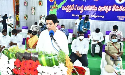 Finance Minister Buggana Rajendranath Reddy addressing at the State Formation Day celebrations at Sunaina Auditorium in Kurnool on Sunday