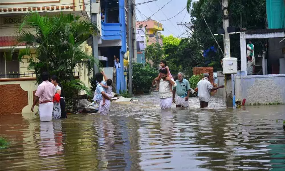 Tenants fleeing from flooded areas in city