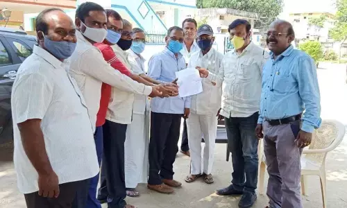 ZP CEO Yadaiah and sarpanch Bukka Venkatesham in the presence of MPDO in Jadcherla on Monday