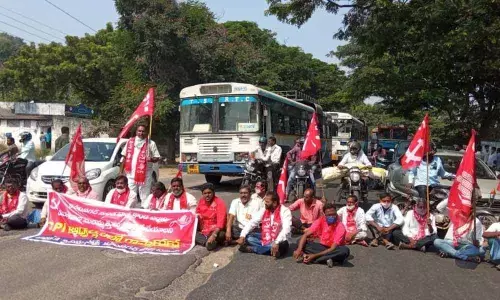 CPI district leaders staging a sit-in dharna on national highway at Chenjerla on Monday