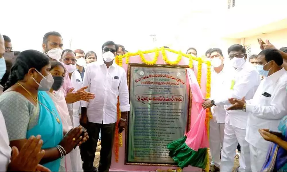 Transport Minister Puvvada Ajay Kumar inaugurating double bedroom houses at Manchukonda village on Tuesday