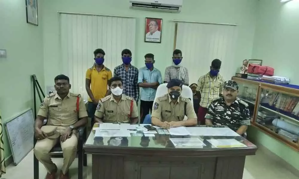 ASP M Rajesh Chandra producing the arrested Maoists before the media at his office in Bhadrachalam on Tuesday