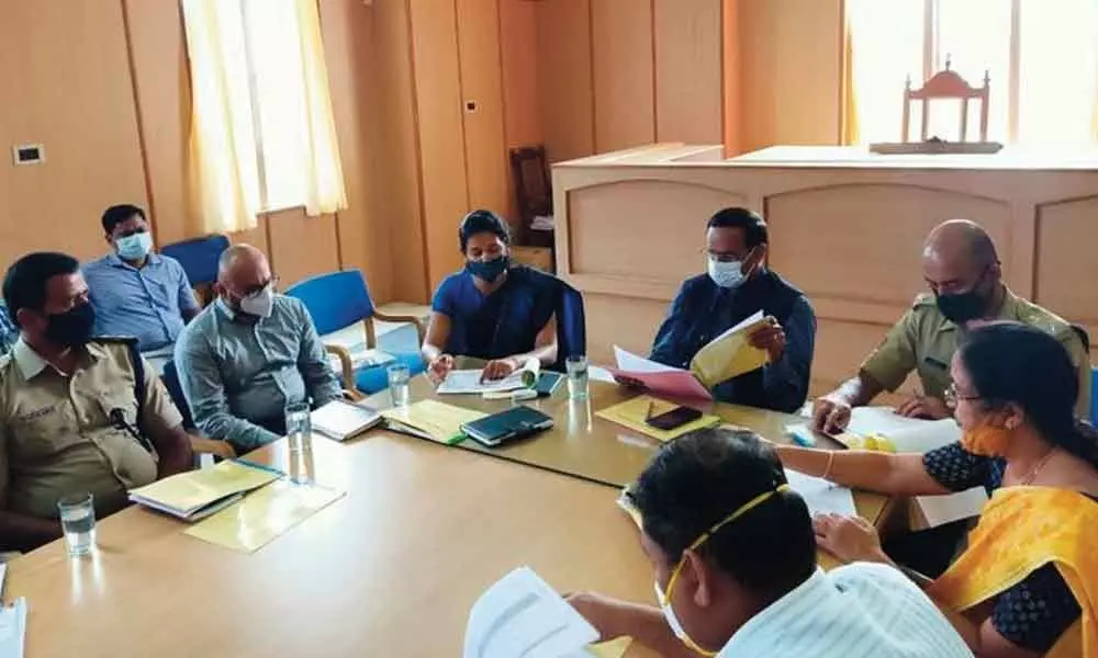 Mysuru district in-charge secretary N Jayaram during a meeting with Mysuru DC Rohini Sindhuri and other district level officers