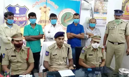 ASP P Shabarish producing the arrested Maoist couriers before the media at his office in Manugur on Wednesday