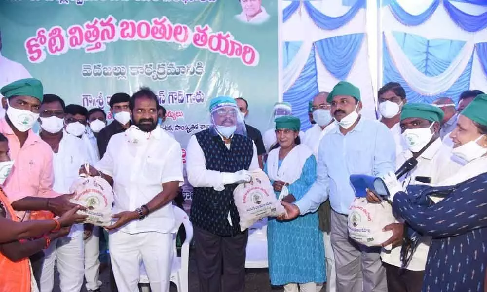Excise Minister Srinivas Goud and District Collector Venkat Rao distributing seed balls in Mahabubnagar