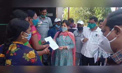 GWMC Commissioner Pamela Satpathy handing over maintenance permit of Loo Café toilets to transgenders in Warangal on Thursday