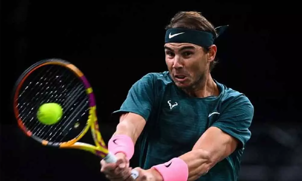 Nadal into last 8, chasing elusive title