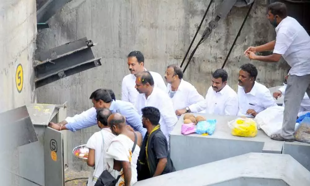 Deputy Chief Minister Amzath Basha releasing water from Velikallu project by pressing a button in Rayachoti on Saturday